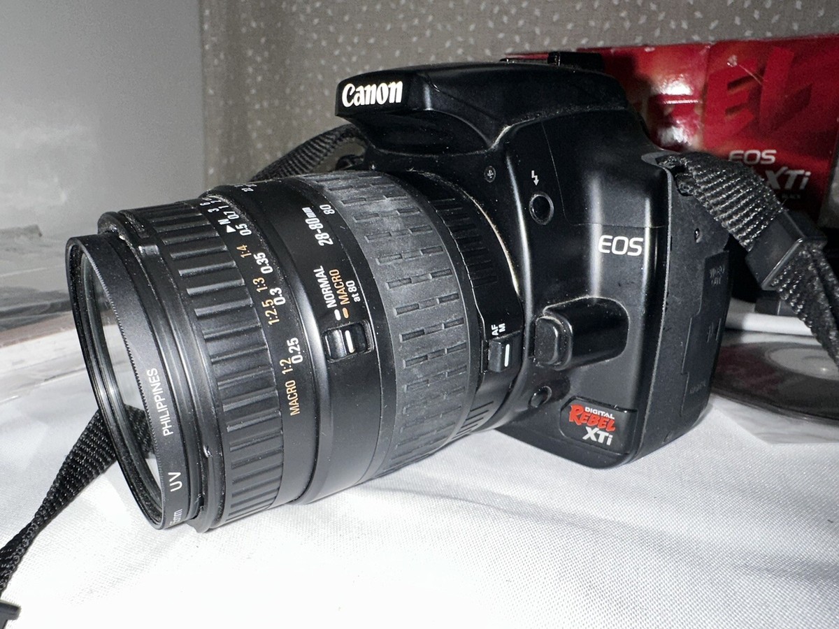 Preowned CANON EOS REBEL XTi with EFS 18-55mm f3.5-5.6 lens- READ