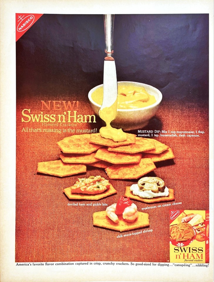 A vintage magazine print ad for Swiss & Ham flavored crackers is the kind of gloriously weird food-culture artifact that belongs framed in a kitchen or office.