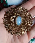 Vintage Gold-Tone Dragons Breath Glass Cabochon Round Brooch Costume Jewelry 2"