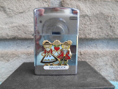 VINTAGE AADLP CIGARETTE LIGHTER WITH INNSBRUCK AUSTRIA TRAVEL EMBLEM