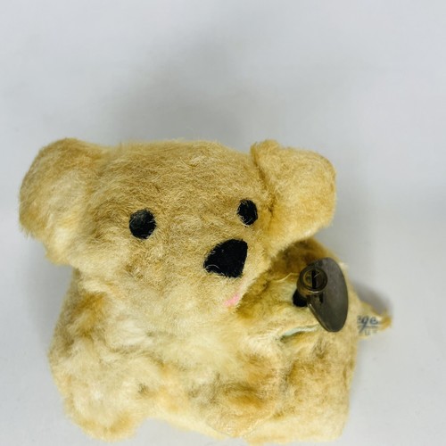 antique teddy bear with music box inside