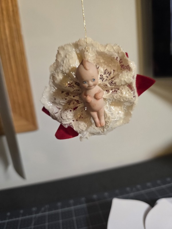 Porcelain 2 Inch Kewpie Doll with Laquered Lace and Red Velevt Bow Ornament 3 In