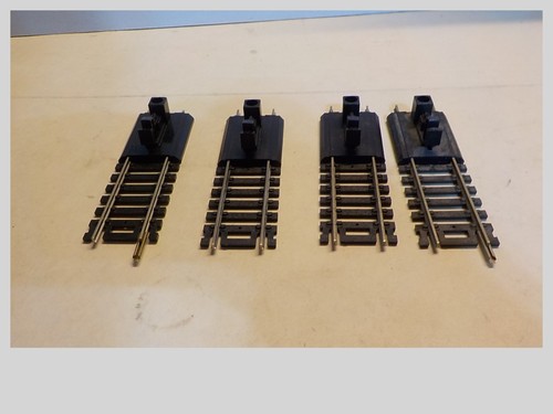 HO LOT OF 4 USED NICKEL/SILVER BUMPERS
