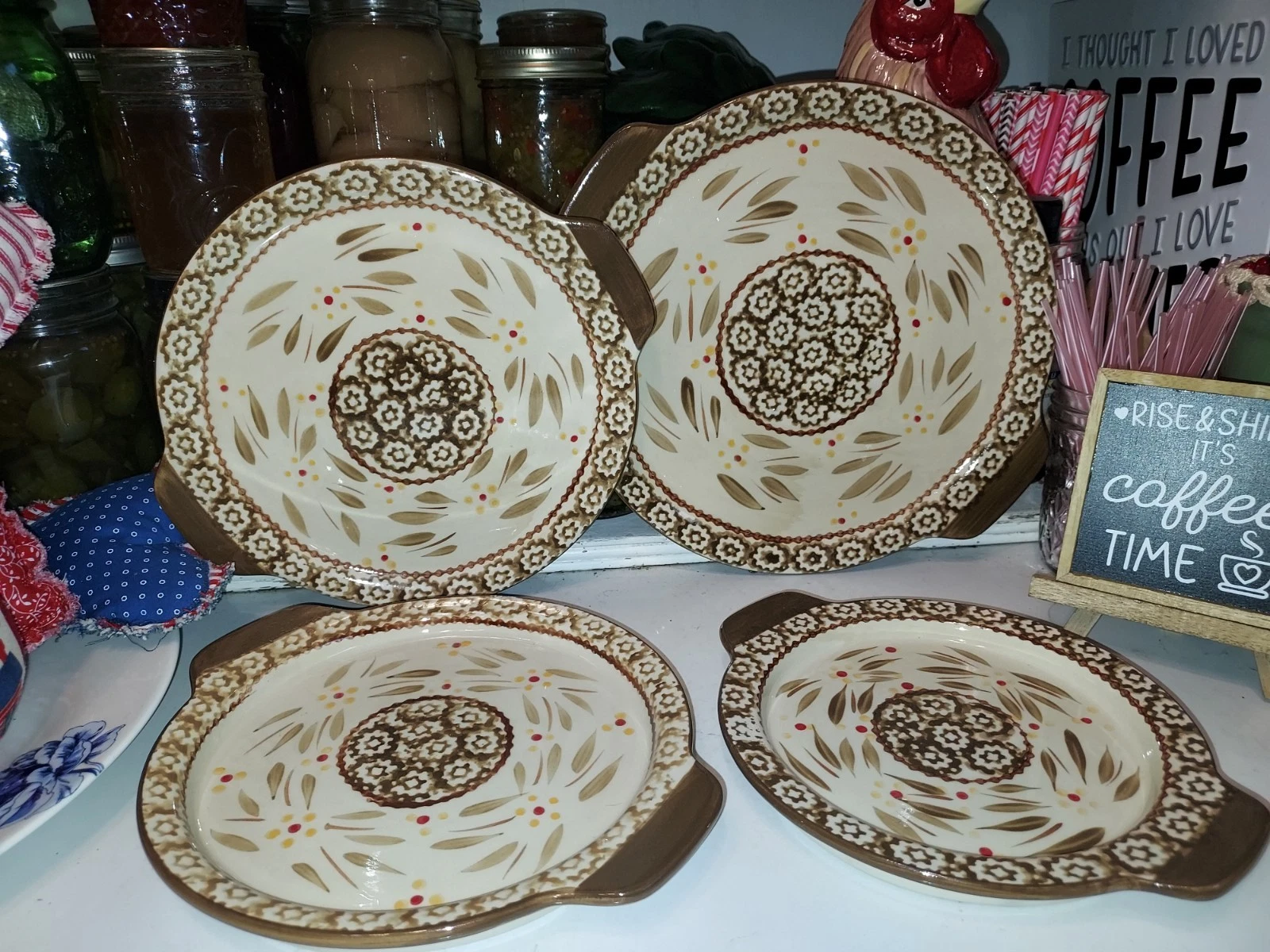 Temptations Old World brown 4 Piece Stacking Round Handled Plates Trays Trivets