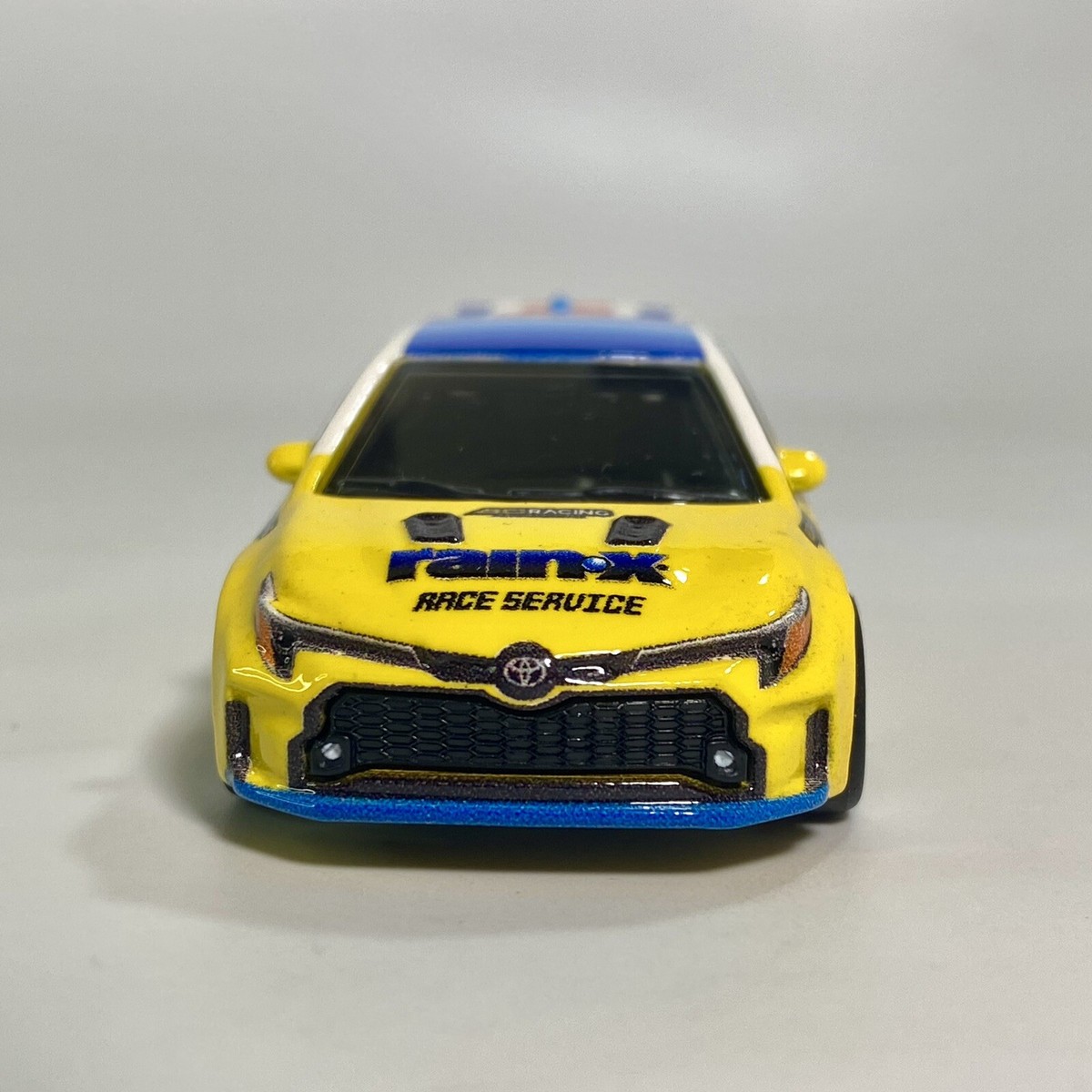 2023 Toyota GR Corolla RainX Yellow 1:64 Premium Diecast Diorama