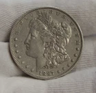 1887  US Morgan Silver Dollar $ VF (Cleaned)