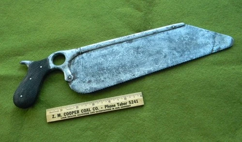 Civil War surgeon's pistol grip amputation saw, checkered gutta percha handles.