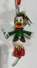 Disney Parks Santa Workshop Elf Donald Duck Glitter Pull String Painted Ornament