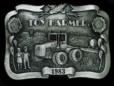 TG11154 *NOS* VINTAGE 1983 **TOY FARMER** COMMEMORATIVE BELT BUCKLE