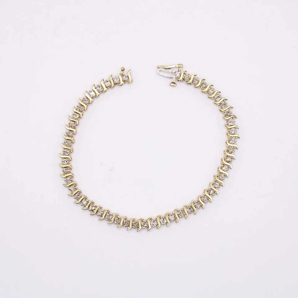 Brazalete de tenis de 7" de diamantes de corte redondo de 1,25 quilates de oro amarillo de 10 k de 7,7 gramos Foto 4 de 4