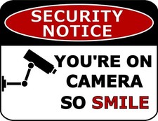 Security Notice - You're On Camera So Smile 11.5 x 9 Laminated Sign