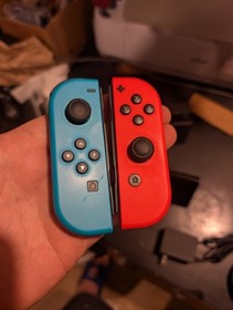 Nintendo Switch with Red And Blue Joycons (HAC-001)  W/ Charger And Dock
