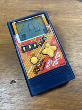 Vintage Casio CG-84 Mad Fighter Handheld game
