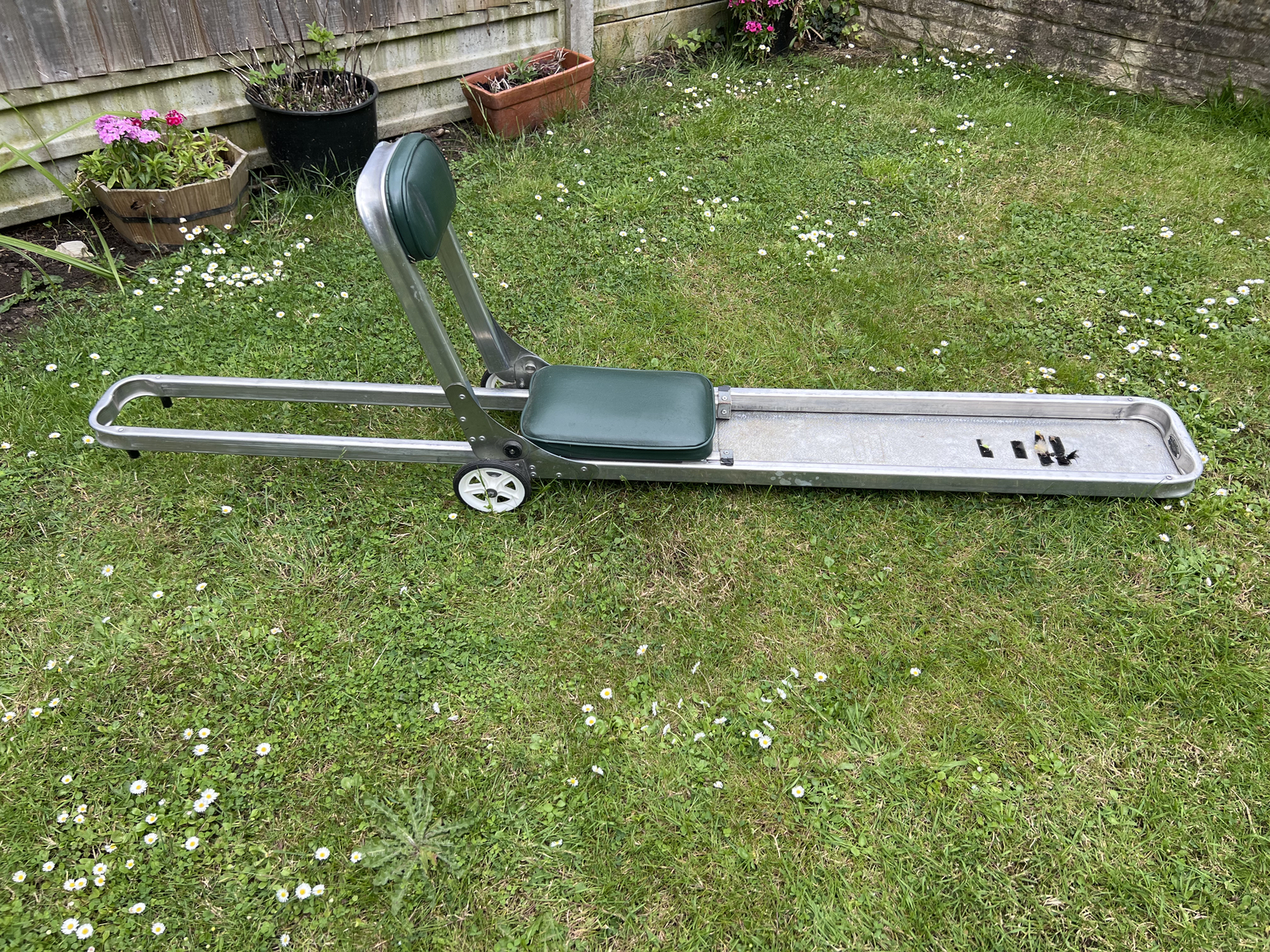 Rutland fly fishing boat seat in used condition with added wheels for