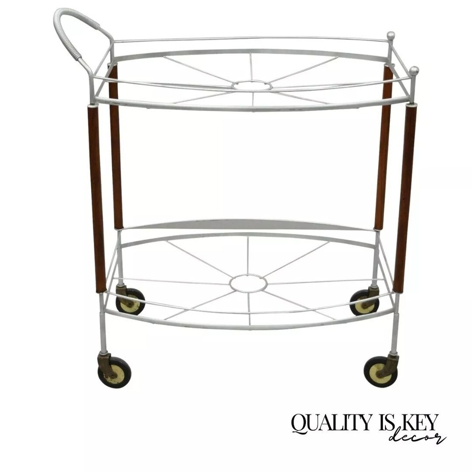 An 'Atomic Era' metal rolling bar cart server — the Atomic Era label means wild geometric details and space-age styling that you simply cannot reproduce today.