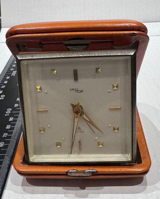 Vintage imhof schweizer reiseuhr, in orange leder. Funktioniert -hält gut die Zeit