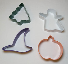 Four colorful metal holiday cookie cutters tree witch hat pumpkin ghost 3 inches