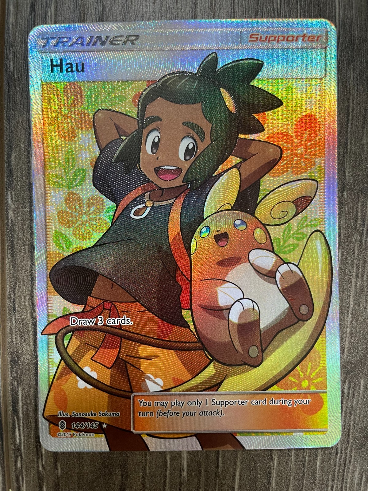 Pokemon Hau Trainer (Full Art) 144/145 Sm-Guardians Rising Holo (Near Mint)