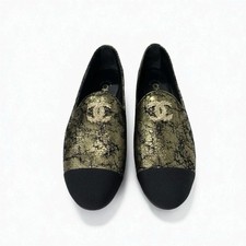 Mocassini CHANEL in pelle taglia 36,5 US 6,5 nero oro da donna