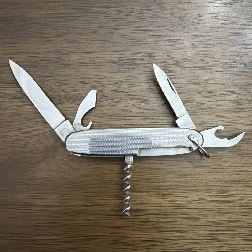 A Cold War-era Mikov multi-tool from Czechoslovakia with checkered grips — obscure Eastern Bloc provenance makes this a genuine conversation piece.