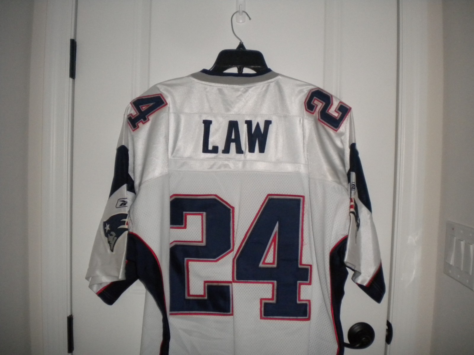 TY LAW # 24   NEW ENGLAND PATROITS  FOOTBALL JERSEY SIZE 56