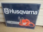 HUSQVARNA CHAINSAW EMBOSSED TIN DEALER SIGN 23 1/4" X 19 1/4"