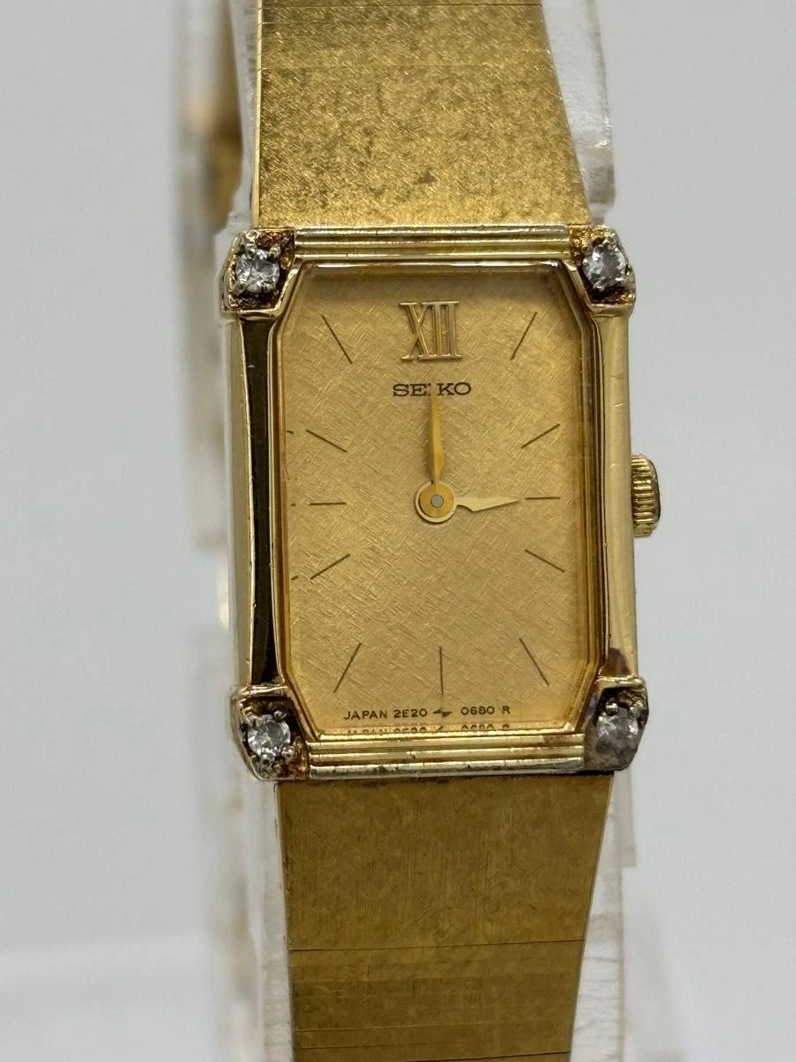 Reloj de cuarzo para dama Seiko 2E20-5520 esfera dorada 4 piedras correa genuina de Japón