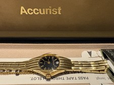 A Gold-tone Accurist Quartz Wristwatch with A Black Dial and Diamond Accent New