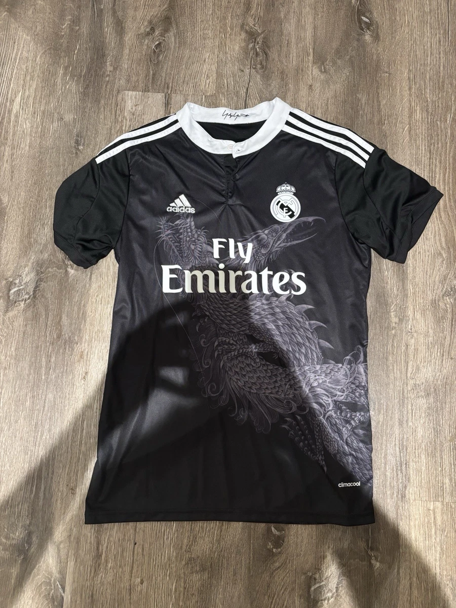 Preços baixos em Real Madrid Black International Club Camisas de