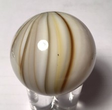 A contemporary earth tone marble. it measures 1.58 inch in mint condition.