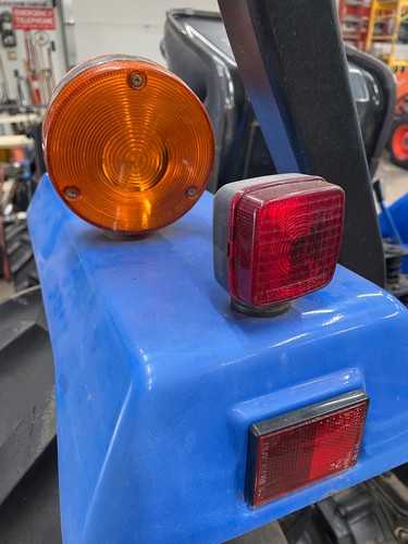Original NH TC30 Taillight and Safety Flasher. 2002 New Holland farm tractor.