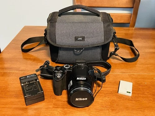 Nikon COOLPIX P100 Digital Camera 10.3 MP Battery. Charger, Strap, Carrying Case