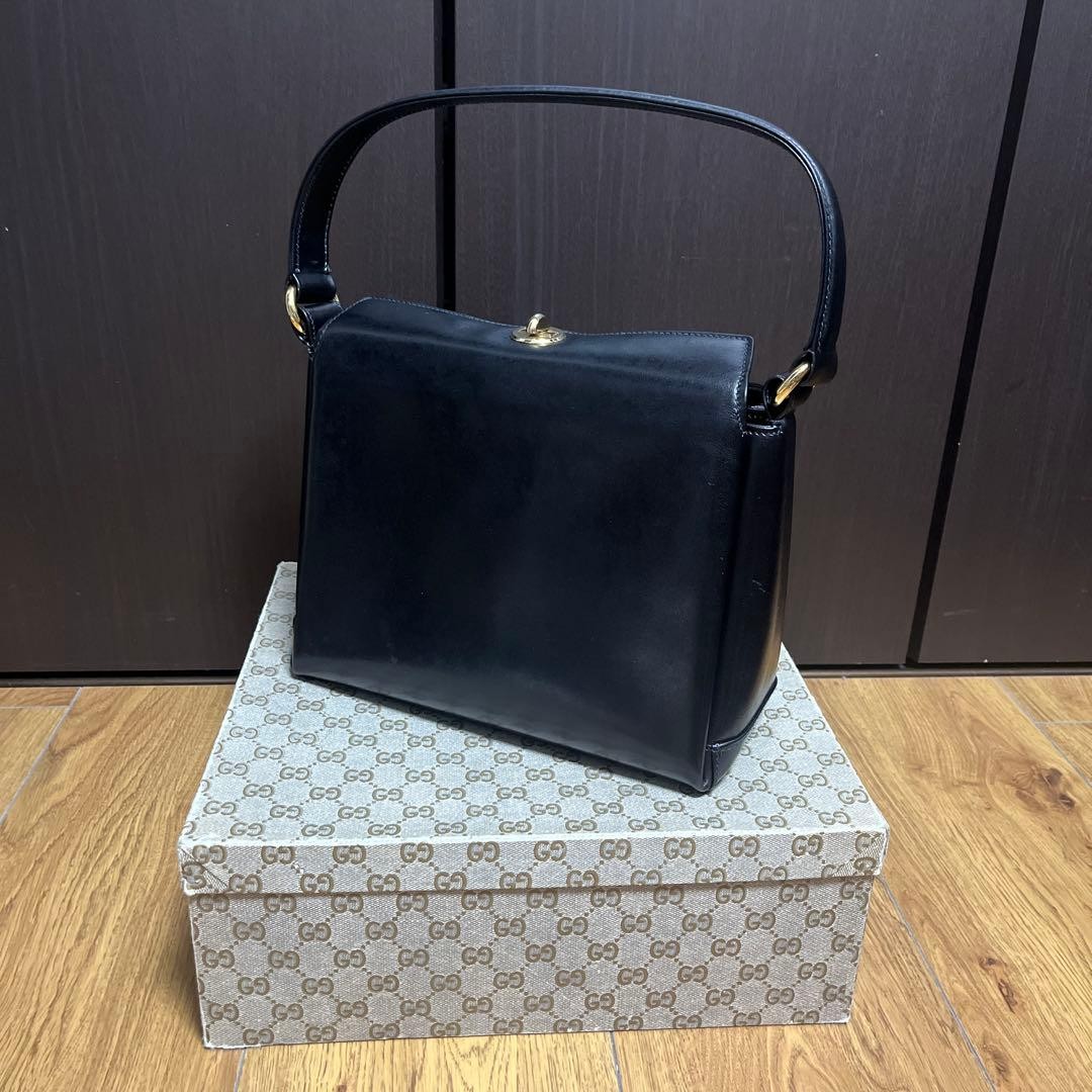 Bolso de mano Gucci de cuero para mujer negro dorado cierre giratorio usado cuero real