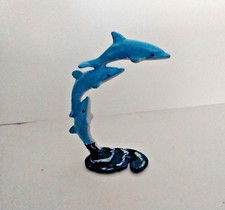 dolphins jumping from water