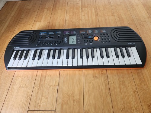 Casio SA-76 Electronic Keyboard 100 Tones Black/Orange Great Condition
