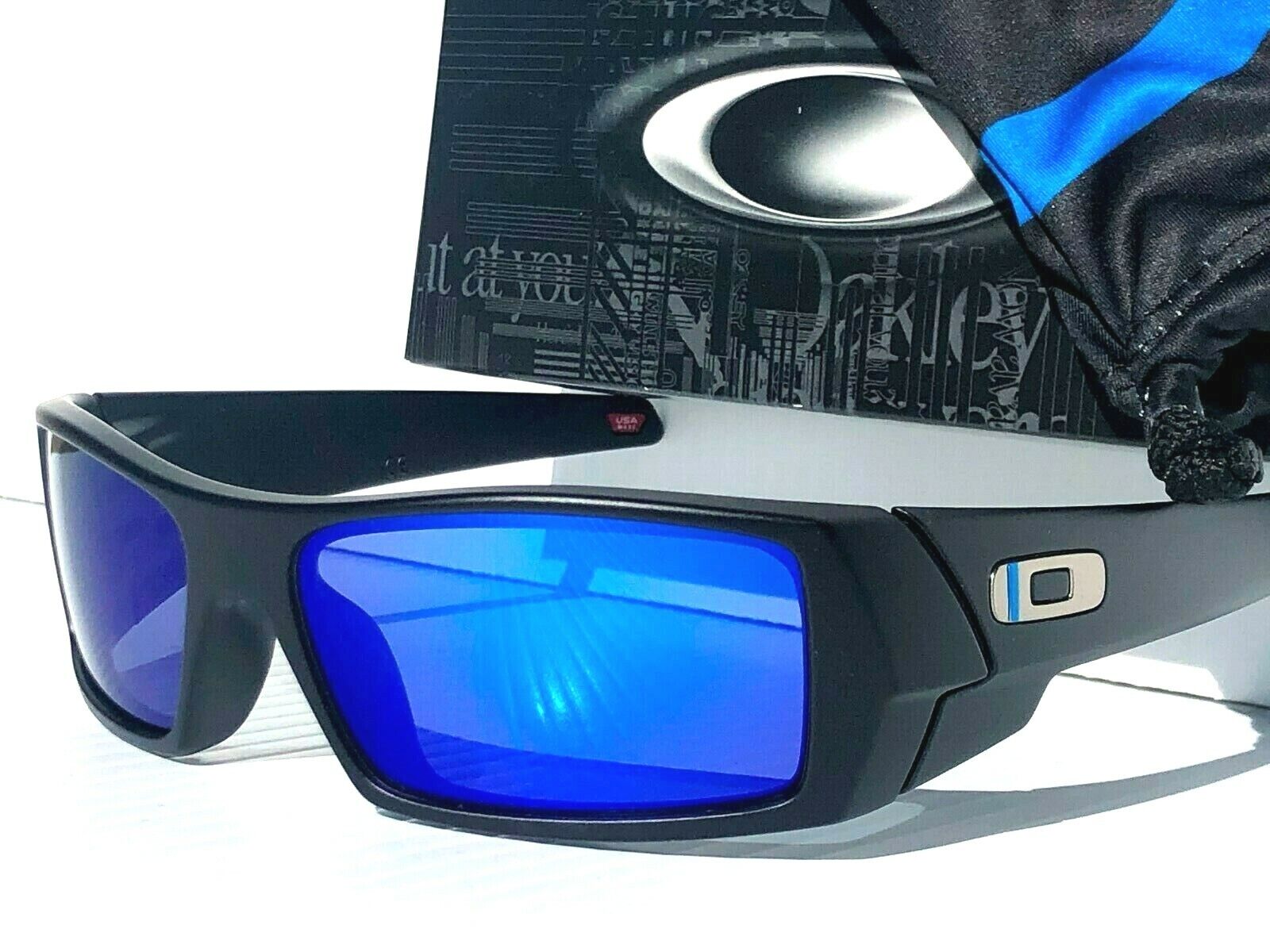 Oakley logo-print blue-tinted Sunglasses - Farfetch