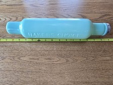 This is a "Baker's Choice" jadeite glass rolling pin.