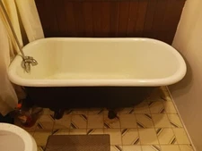 1923 Louisville Works Cast Iron Clawfoot Tub with faucet, shower head and drain.