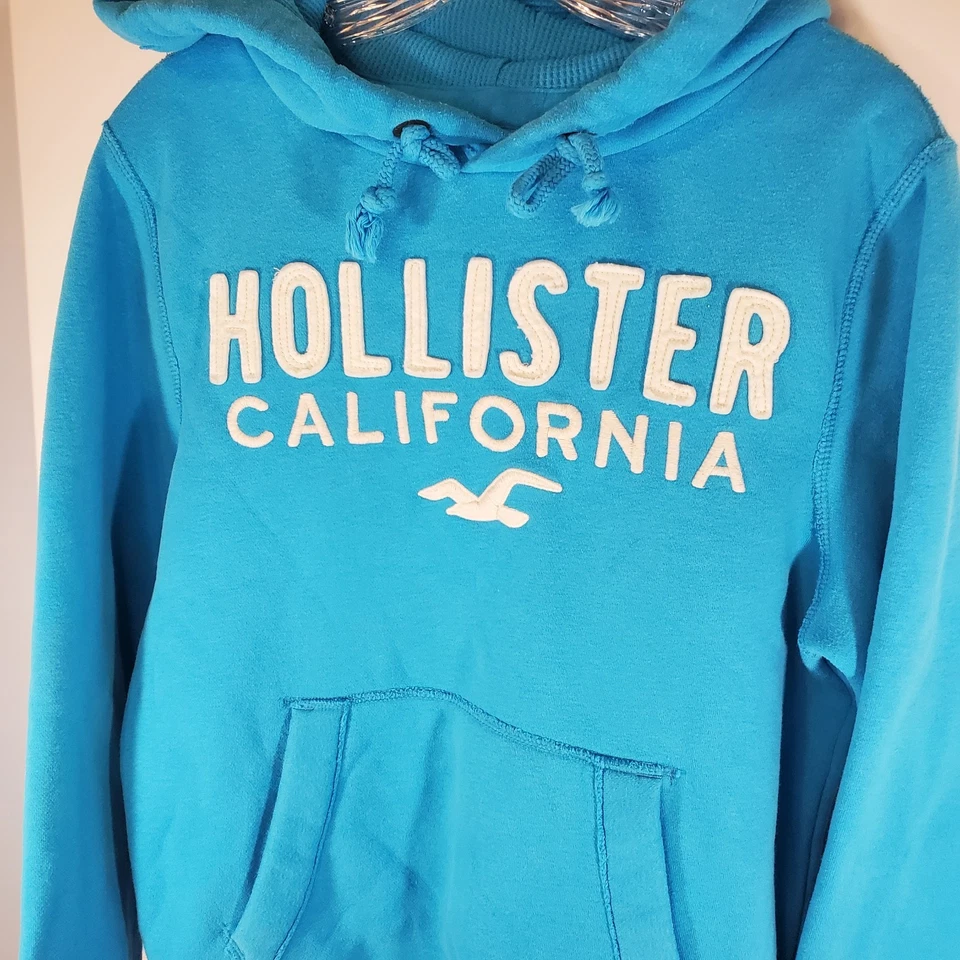 Sudadera con capucha de bolsillo HOLLISTER California para mujer talla pequeña azul océano Foto 2 de 4