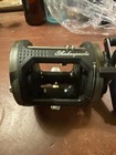 Shakespeare camo bait Caster fishing reel RH New — photo 3
