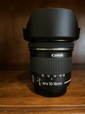 Canon EF-S 10-18mm f/4.5-5.6 IS STM ultra-wide zoom, with the Canon hood