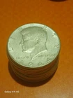 1964 KENNEDY SILVER HALF DOLLAR ROLL OF 20 COINS.