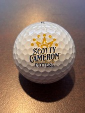 Scotty Cameron / Titleist Pro V1 7 Point Crown Gold logo ball.
