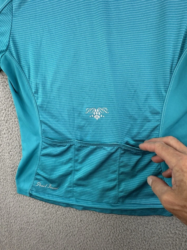 Camiseta deportiva de ciclismo Pearl Izumi Select para mujer azul medio bolsillos de poliéster cremallera completa Foto 3 de 4