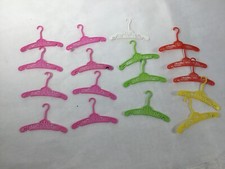 Vtg. lot Barbie hangers bright colors plastic 13