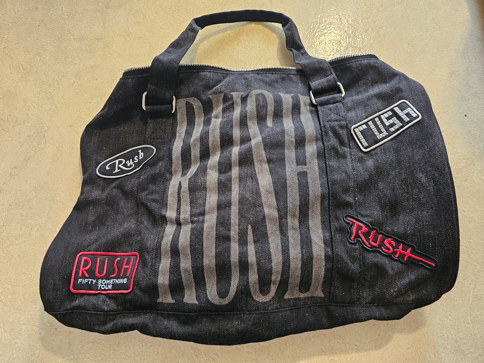 Rush fifty something tour duffel bag ear protectors travel concert merchandise