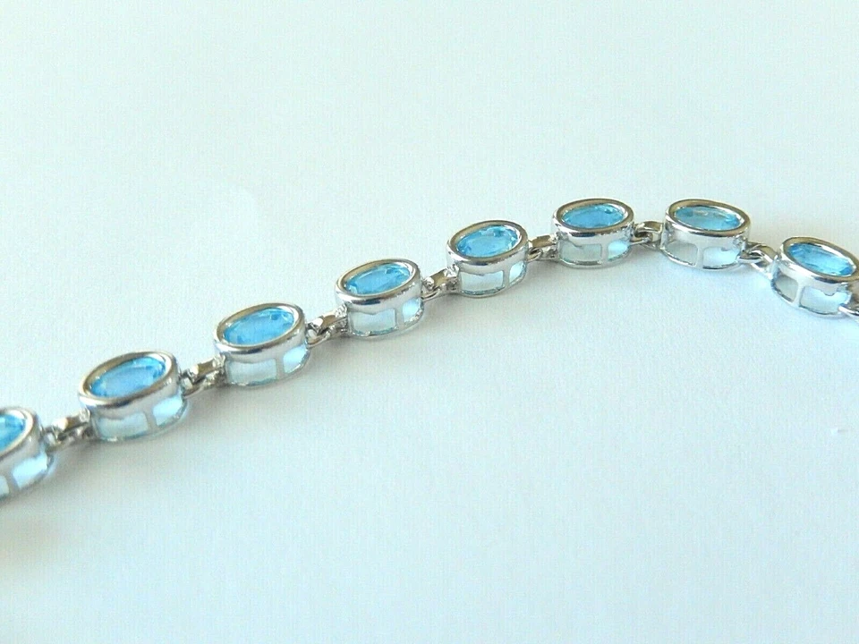 *NUEVO CON ETIQUETAS* BRAZALETE TENIS TOPACIO AZUL OVALADO ORO BLANCO 14K 8,50 CT 7,25" - 8,2 gms Foto 3 de 4