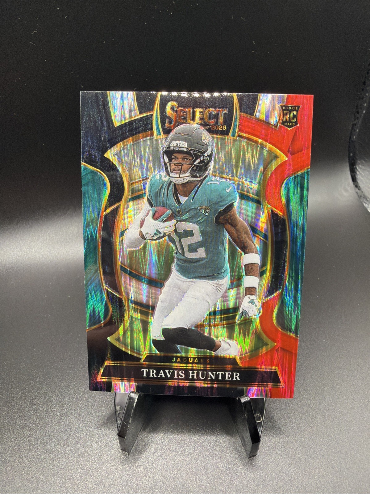 2025 Panini Select Travis Hunter #28 Concourse RC — Black & Orange Shock Prizm