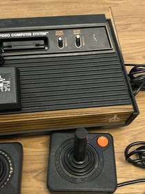 Atari 2600 Woodgrain 4 Switch Console w/ 25 Games 2 joysticks Tested Working