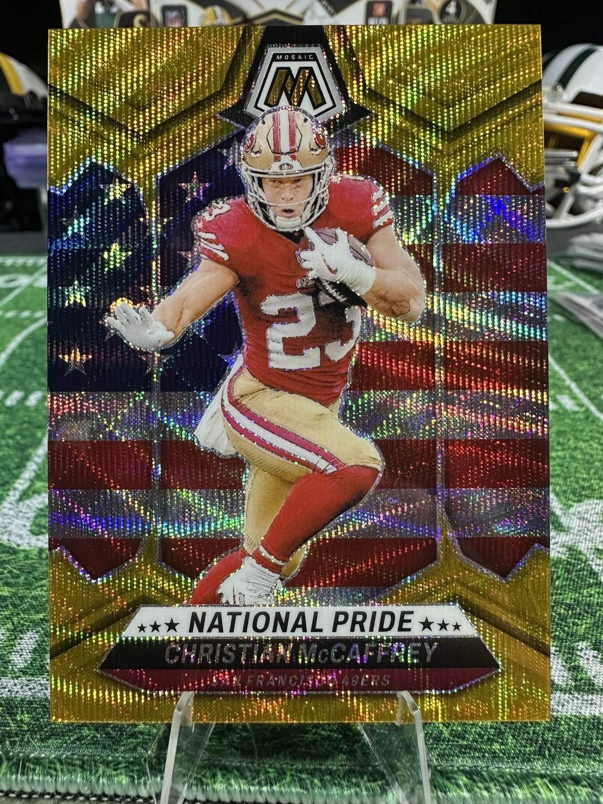 2024 Panini Mosaic National Pride Christian McCaffrey #256 Gold Wave Mosaic /17